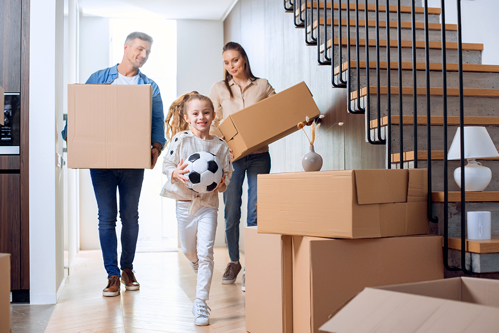 A father, mother, and daughter family moving into their new house after it passed a thorough home inspection