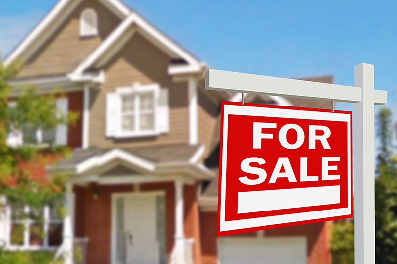 For Sale sign in front of a new home after receiving a full list of home inspection services 